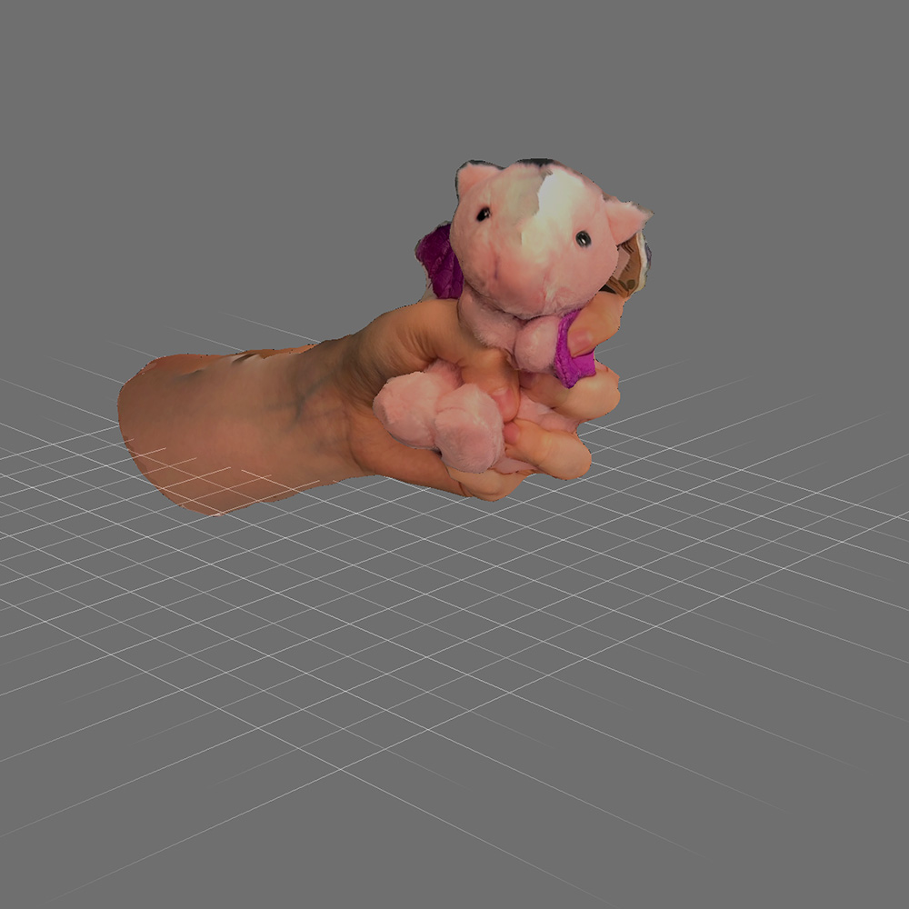 Thought about cuteness agression and had Lucy squeeze the stuffed dragon. This is the 3d model of that in meshmixer after using scaniverse.