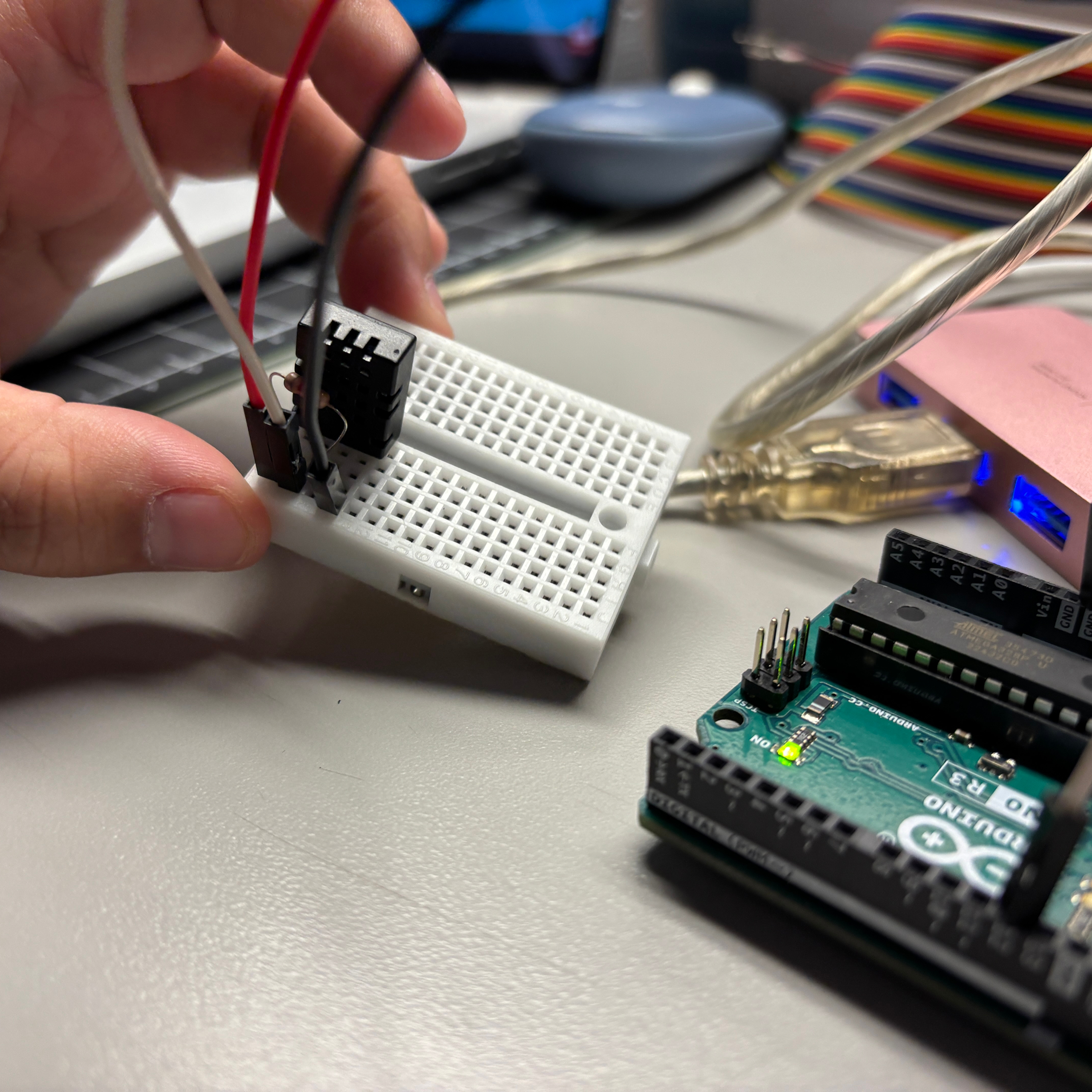 We then tried to add a resistor between the data and power pins as suggested in some videos we had watched online. However, this also did not improve the accuracy of our temperature readings.
